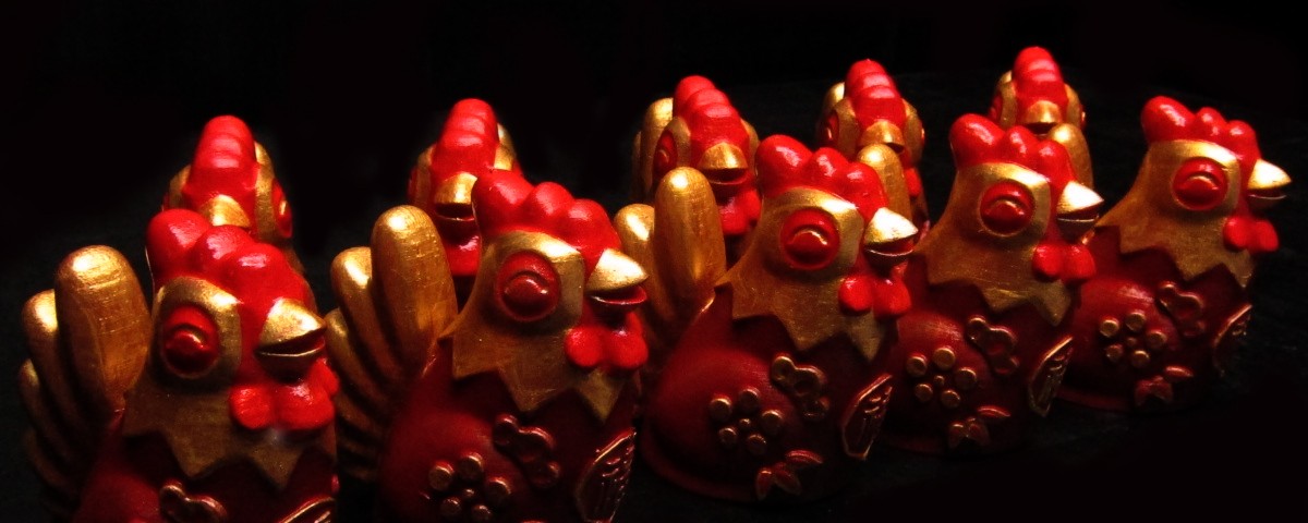 Golden fire roosters figurines